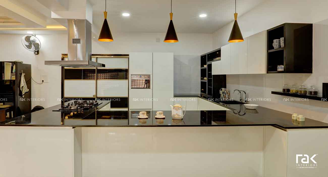 Glossy finished black and white kitchen.